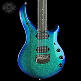 Blue glitter electric guitar on a black background with 'Tone Shop' logo.