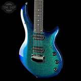 Blue glitter electric guitar on a black background with 'Tone Shop' logo.