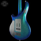 Blue glitter electric guitar on a black background with 'Tone Shop' logo.