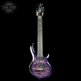 Electric guitar with a purple and black flame pattern on a white background