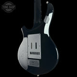 Black electric guitar with a visible brand logo on a white background
