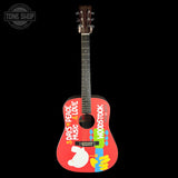 Colorful acoustic guitar with 'Woodstock' branding on a black background