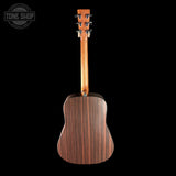 Back view of a wooden acoustic guitar on a black background with 'Tone Shop' logo.
