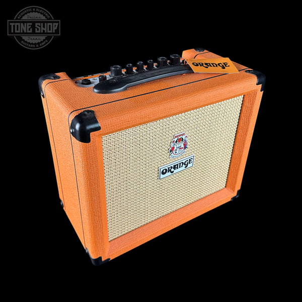 Orange guitar amplifier with brand logo on a black background