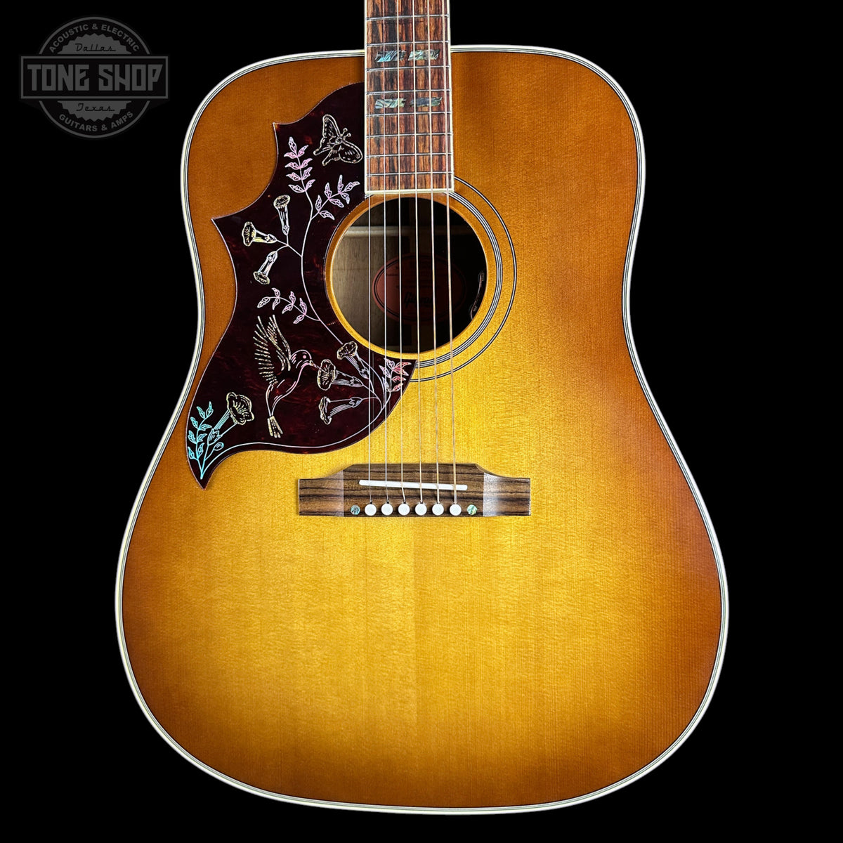 Front of Gibson Hummingbird Elegant Koa Left Handed Honey Burst.
