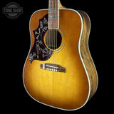 Front angle of Gibson Hummingbird Elegant Koa Left Handed Honey Burst.