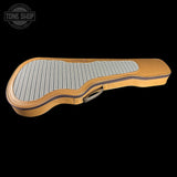 Guitar case with checkered interior on a black background, featuring 'Tone Shop' logo.