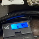 Rickenbacker 4003S Jetglo Bass on scale displaying weight.