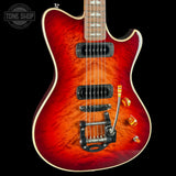 Red electric guitar with a visible brand logo on a black background