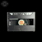 Guitar amplifier cabinet with brand logo in the corner