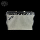 Fender Deluxe Reverb amplifier on a black background with 'Tone Shop' logo.