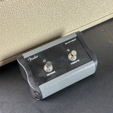 Fender guitar effect pedal with two knobs on a textured surface