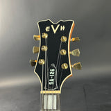 Guitar headstock with 'EVH' branding on a gray background
