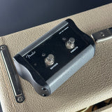 Fender guitar pedal with footswitches on a guitar amplifier