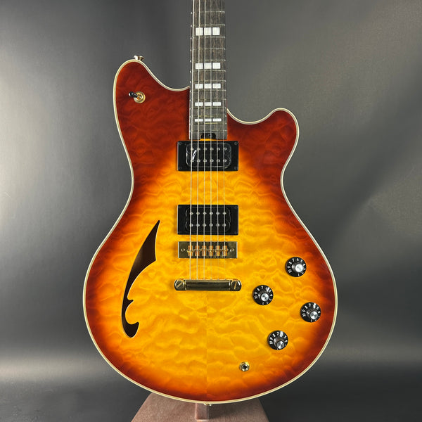 Electric guitar with a sunburst finish on a gray background