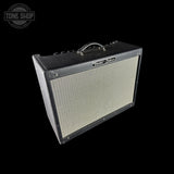 Fender Deluxe guitar amplifier on a black background with 'Tone Shop' logo.