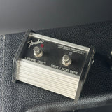 Fender guitar pedal on a textured black surface