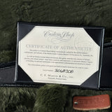 Certificate of Authenticity for a C.F. Martin & Co. guitar on a textured surface