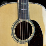 Close-up of an acoustic guitar's soundhole and headstock