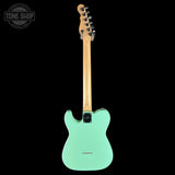 Green electric guitar with a clear background