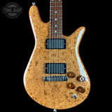 Wooden electric guitar with a visible brand logo on a black background