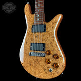 Wooden electric guitar with a visible brand logo on a black background