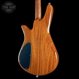 Wooden guitar body with a visible brand logo in the corner