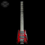 Red electric guitar with a black background