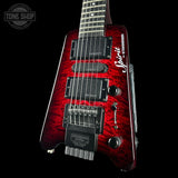 Red electric guitar with 'Spirit' branding on a black background, featuring the Tone Shop logo.
