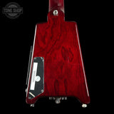 Red electric guitar body with 'Tone Shop' logo in the corner