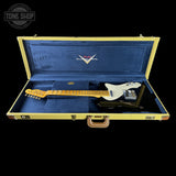 Fender electric guitar in a blue case with 'Tone Shop' logo.