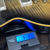 Gibson Custom Dealer Select 1959 Les Paul Standard Chambered Cobra Burst AAA Top VOS on scale displaying weight.