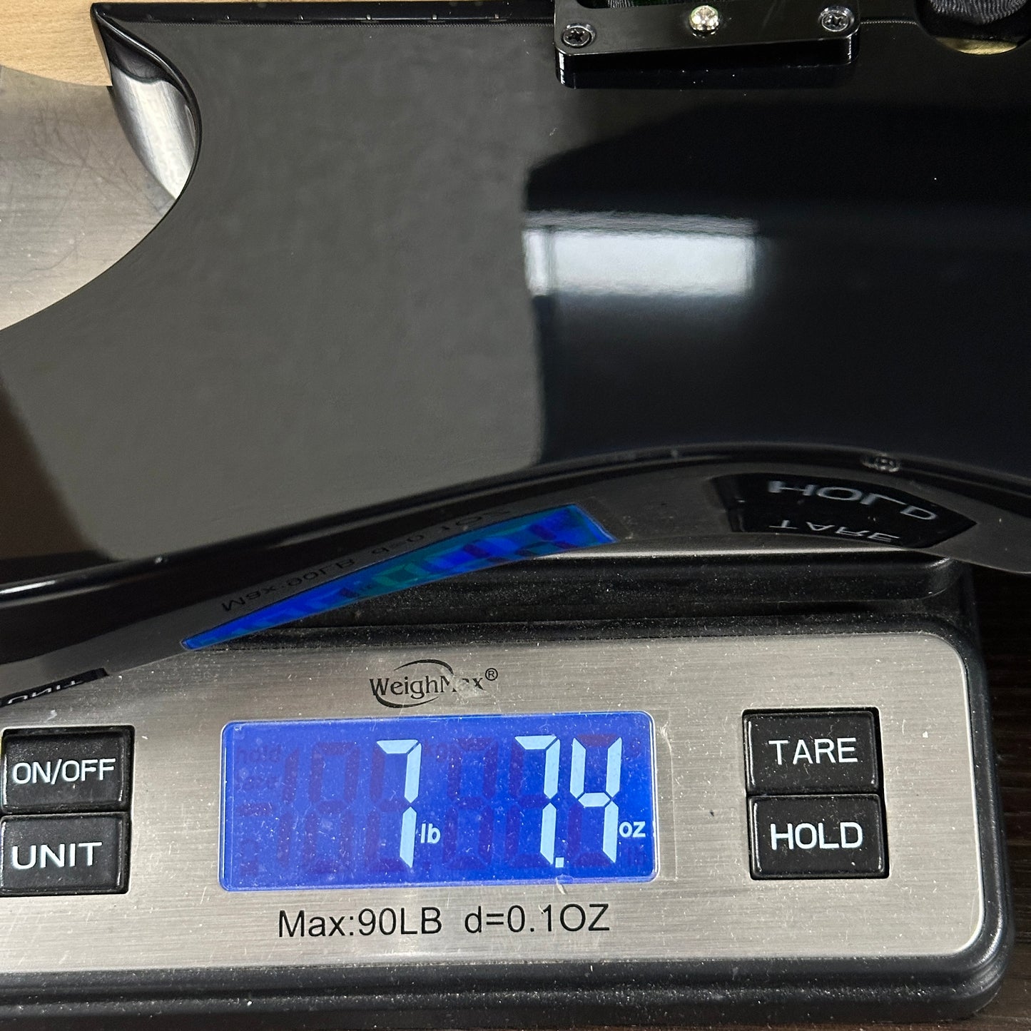 Used Ibanez RG470 MIJ Black on scale displaying weight.