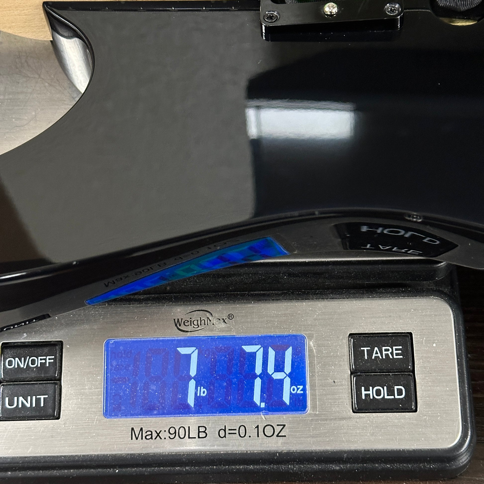 Used Ibanez RG470 MIJ Black on scale displaying weight.