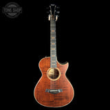 Acoustic guitar with a wavy wood grain pattern on a black background, featuring the Tone Shop logo.