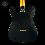 Black electric guitar body with Fender logo on a black background