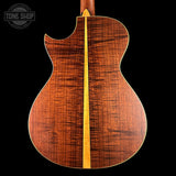 Wooden guitar back with a visible brand logo in the corner