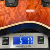 Digital scale displaying weight on a wooden surface