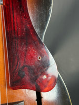 Close-up of a wooden instrument with a dark background