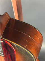 Close-up of a wooden instrument, possibly a violin or viola, with a focus on the sound post.
