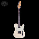 A Fender Telecaster-style electric guitar in a cream/off-white finish with a dark brown neck and black hardware, shown against a solid black background. A 'TONE SHOP' watermark is visible in the top-left corner.
