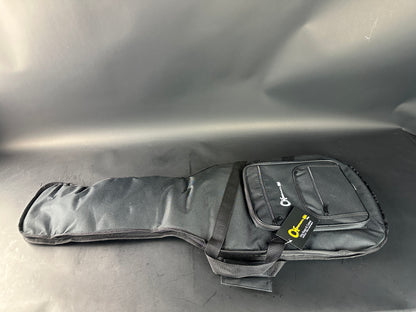 Gray guitar case with a brand label on a reflective surface