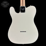 The back of a Fender Telecaster electric guitar in a glossy off-white finish, shown against a solid black background with a Tone Shop watermark in the top-left corner.