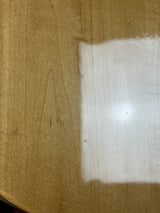 White paper on a brown cardboard background