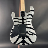 Electric guitar with zebra pattern on a gray background