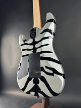 Guitar body with zebra pattern on a dark background