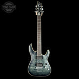 Electric guitar with a blue and gray finish on a black background, featuring the 'Tone Shop' logo.