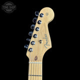 Guitar headstock with Fender logo on a black background