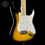 Electric guitar with a sunburst finish on a black background, featuring the Tone Shop logo.