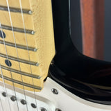 Close-up of an electric guitar's neck and body